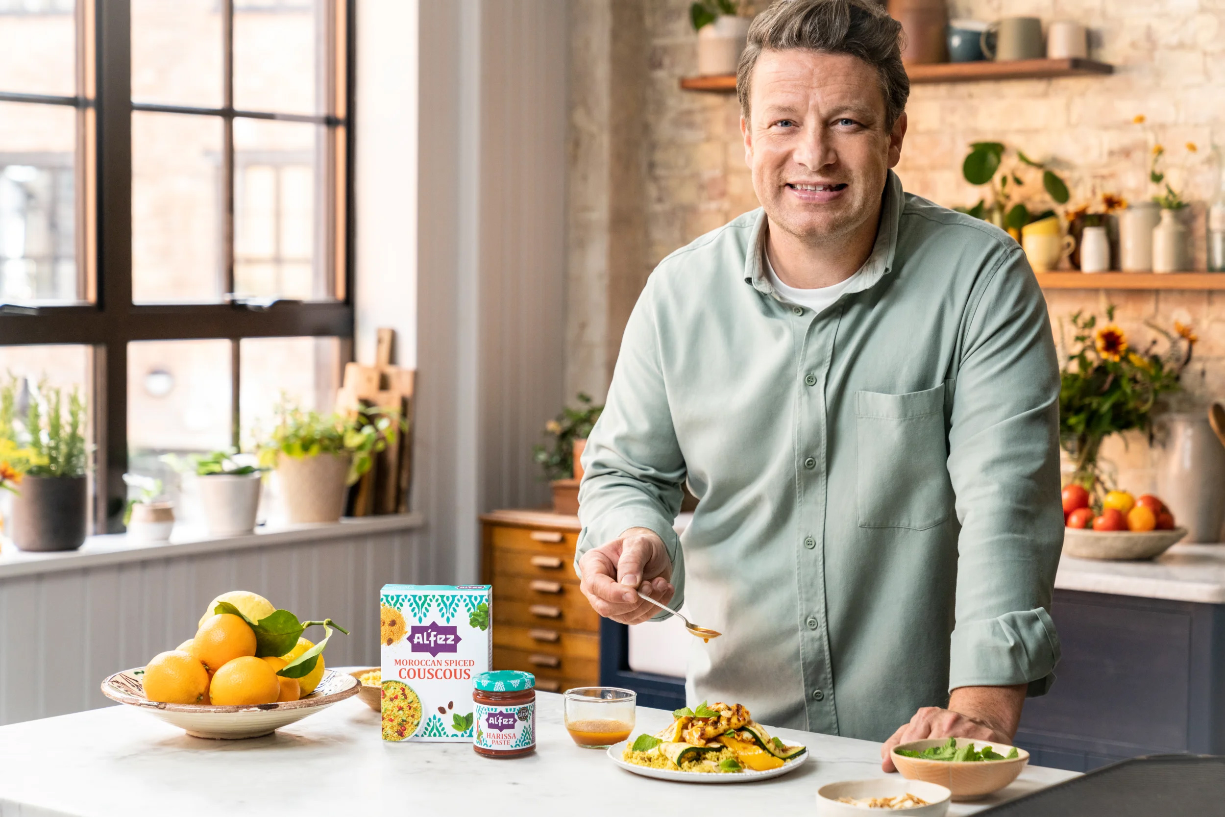 Jamie Oliver in a kitchen with Al'Fez products